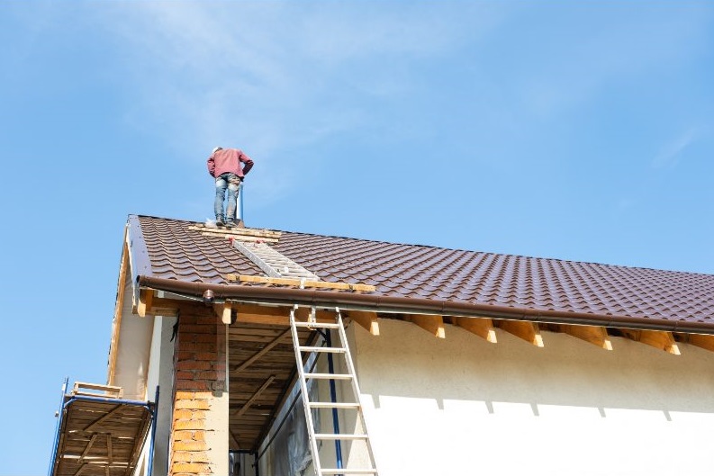 Tough Top Roofing crew working on roof insulation